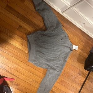 Opened back soft knit sweater. Never worn size large